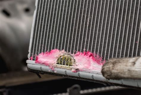 radiator leaking water from bottom|7 Causes of a Coolant Leak: How to Fix It & Repair Cost